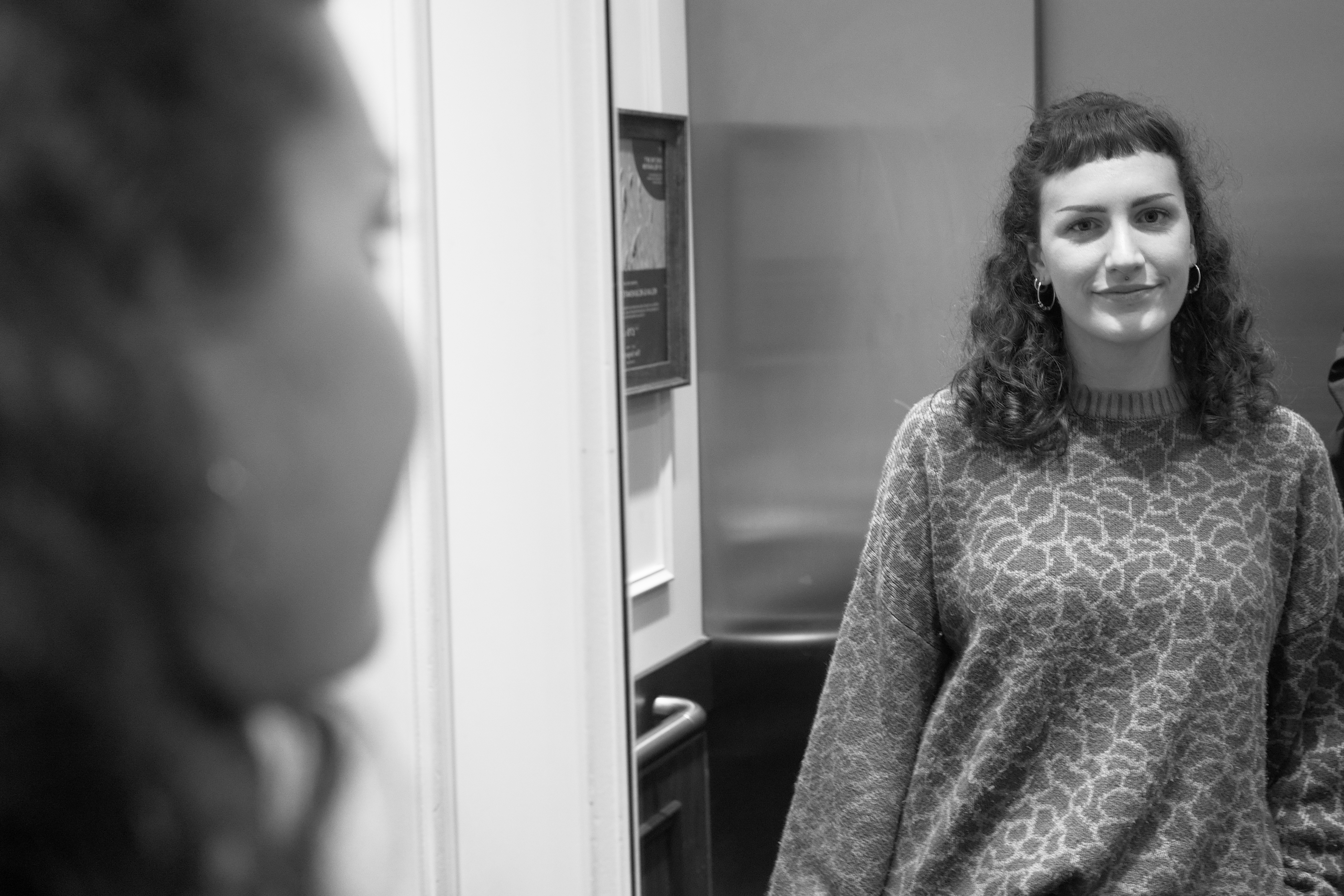 A photo of a woman smiling, taken on a Sigma BF camera