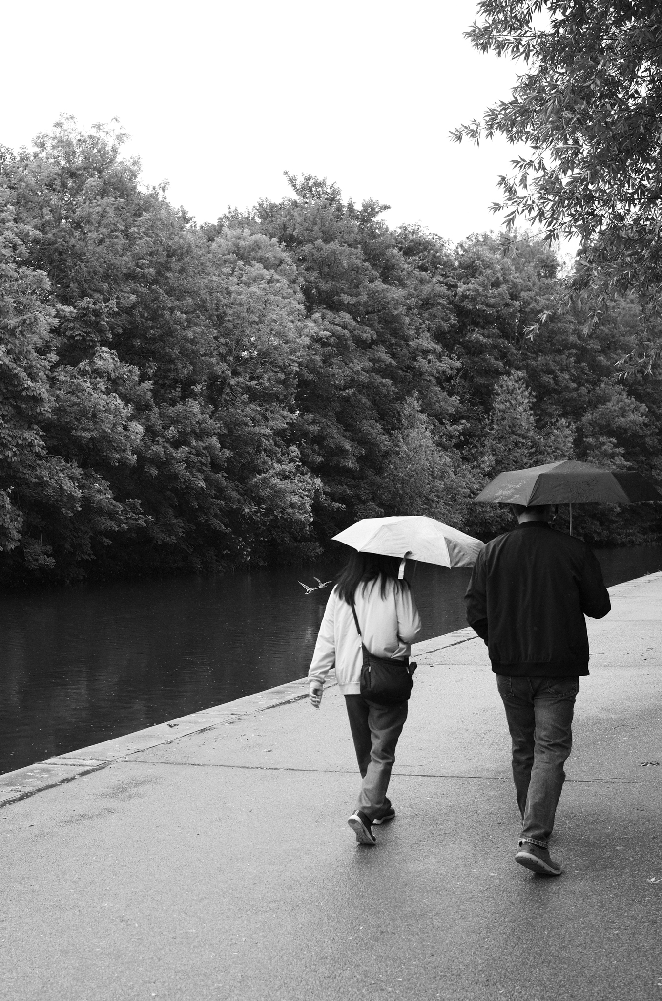 A photo of people walking taken on a Leica M11-D rangefinder camera