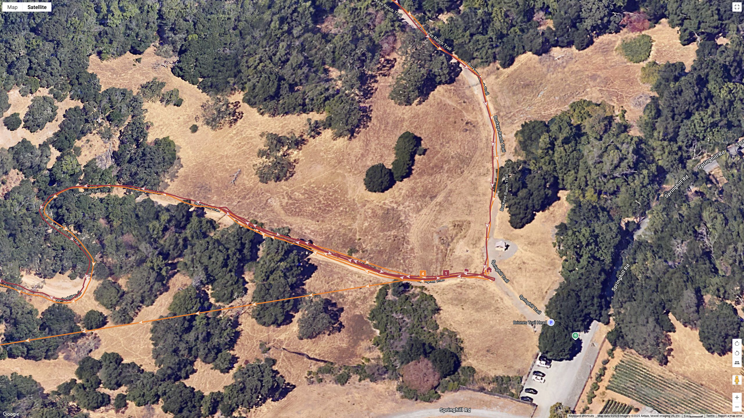 A satellite map showing how the GPS lines for the COROS NOMAD (orange) and Garmin Forerunner 970 (red) compare during a hike.