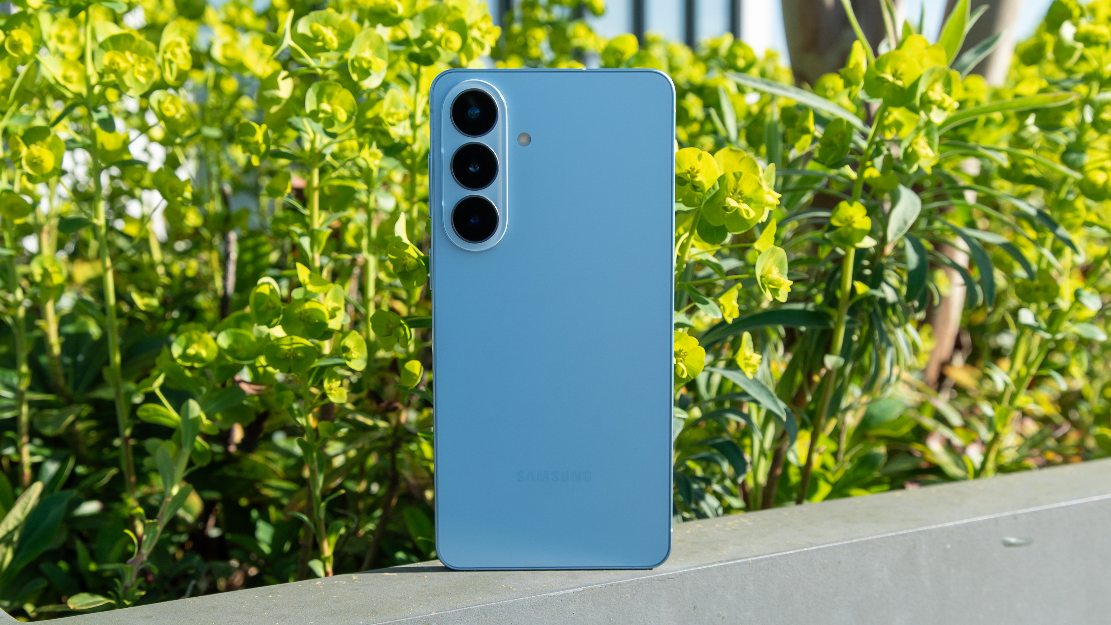 Galaxy S26 Plus in front of a bush