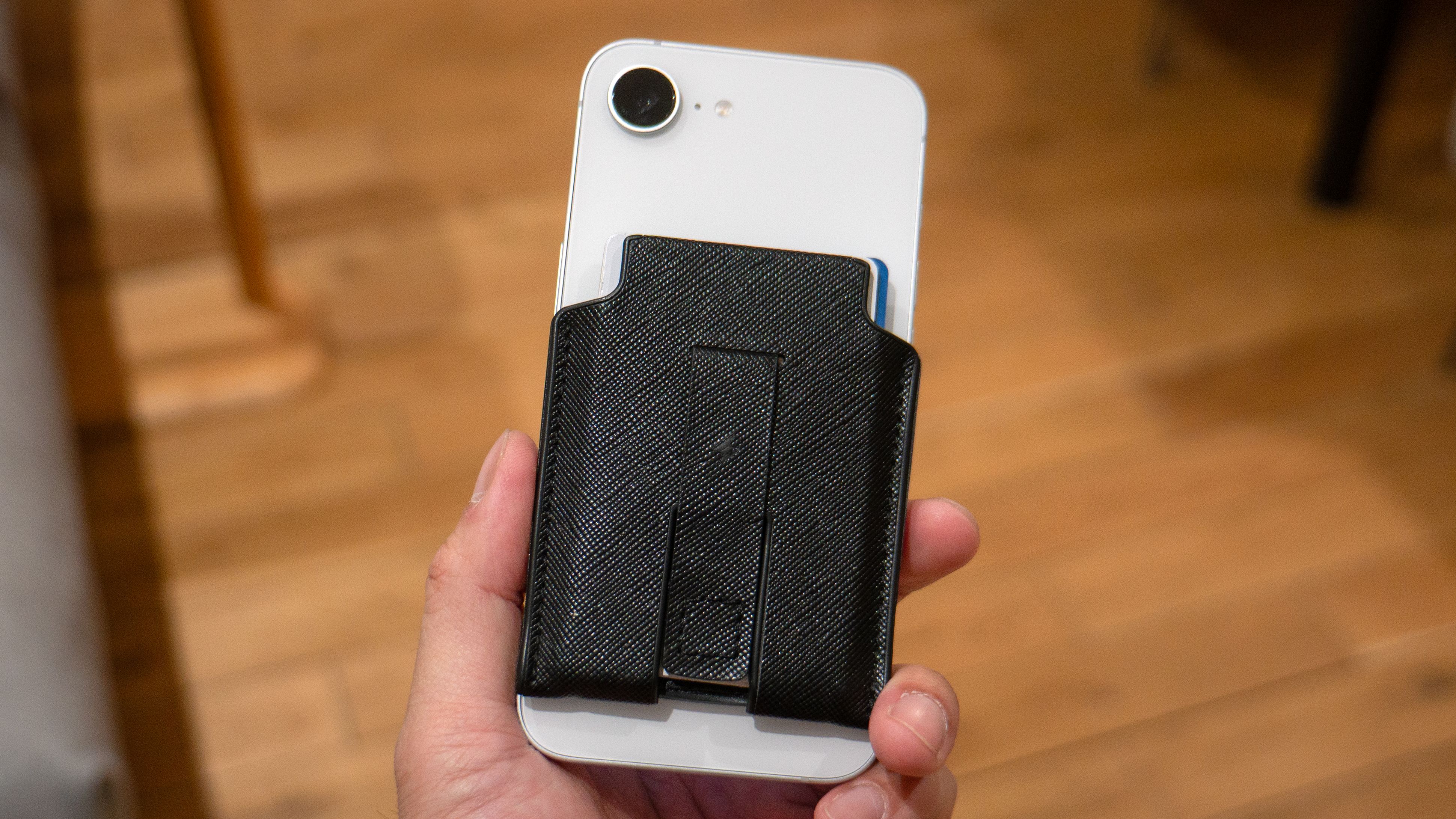 Apple iPhone 17e with a MagSafe Wallet.