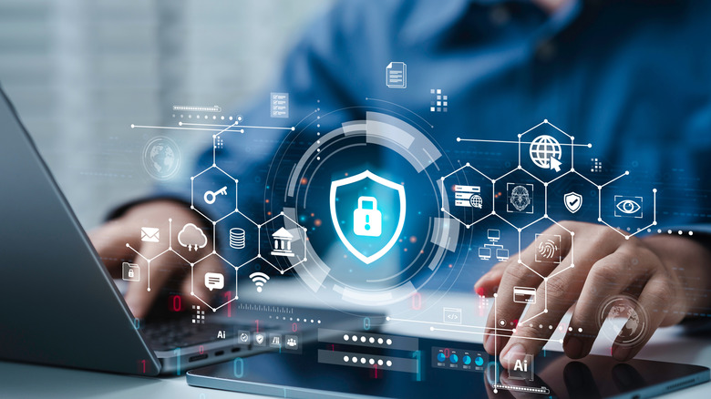 Εικόνα ενός ατόμου που χρησιμοποιεί φορητό υπολογιστή με επικαλυμμένα γραφικά