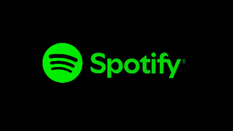 Πράσινο λογότυπο Spotify στην οθόνη με μαύρο φόντο